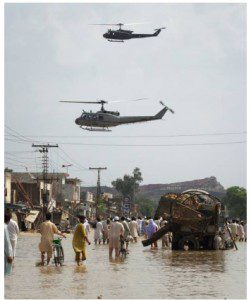 Army helicopters look to distribute relief supplies from the air to the residents of Nowshera. (Adrees Latif/Reuters - courtesy CBC.ca)