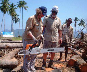 Ms. Una LeDrew, CMAT volunteer is very good with a chainsaw (to the astonishment of the locals). She is seen here helping to clear debris from the island's only roadway destroyed by the December 26 Tsunami. 