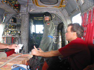 CMAT Volunteer Dr. Kirk Sundby, Orthopedic Surgeon sits on Singapore Air Force Chinook helicopter with rest of CMAT team enroute to Medan. (January, 2005