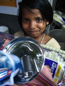 A young girl receives a hygiene "life" kit at Sirumalar Home for Children in Tamil Nadu, India. 