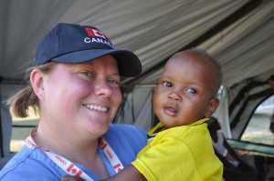 Canadian Medical Assistance Teams executive director and RN Valerie Rzepka shares some smiles with a young patient she helped in Leogane, Haiti.