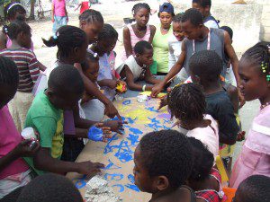 Children at an orphanage in Leogane prepare a thank you banner. 