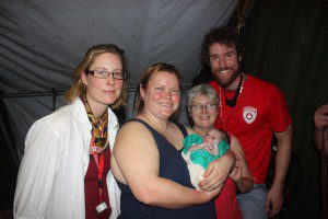 CMAT Nurses (L-R) Olivia Soukup, Valerie Rzepka, Carolyn Davies and Aric Rankin helped welcome a new life into the world in Haiti. 