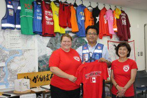 Valerie Rzepka and Seiko Watanabe present a CMAT shirt to the IDRAC Chairman to add to the display.