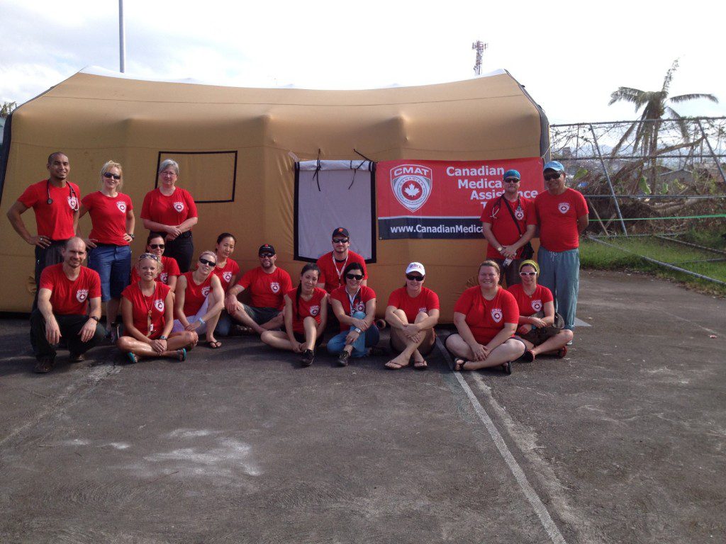 CMAT Team Members gather in front of the field hospital tent in Ormoc City, Leyte.